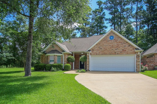 120 Shady Springs Bnd, Lufkin, TX 75901 - view of front of home featuring concrete driveway, a front yard, an attached garage, and brick siding