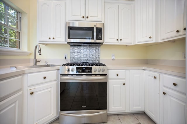 120 Shady Springs Bnd, Lufkin, TX 75901 - kitchen with stainless steel appliances, light countertops, and white cabinets