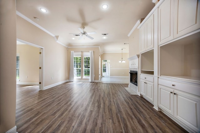 120 Shady Springs Bnd, Lufkin, TX 75901 - unfurnished living room featuring ceiling fan, dark wood-style flooring, recessed lighting, ornamental molding, and a fireplace with flush hearth