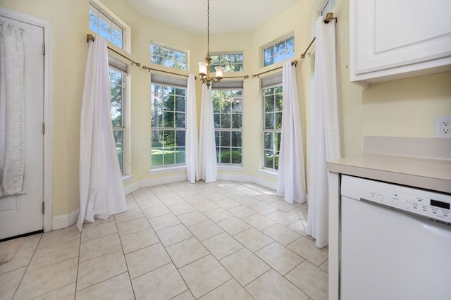 120 Shady Springs Bnd, Lufkin, TX 75901 - unfurnished dining area featuring a chandelier and light tile patterned floors
