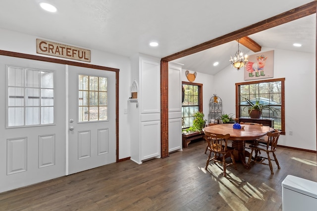 dining space featuring dark wood-type flooring, an inviting chandelier, and vaulted ceiling with beams