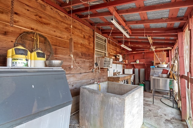 miscellaneous room with wooden walls