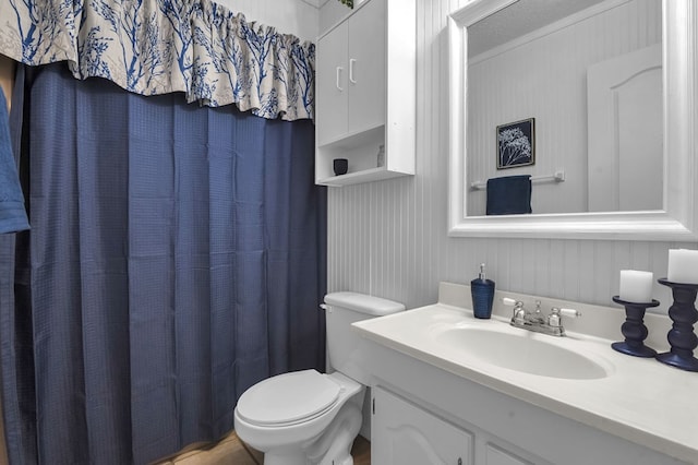 bathroom featuring toilet and vanity