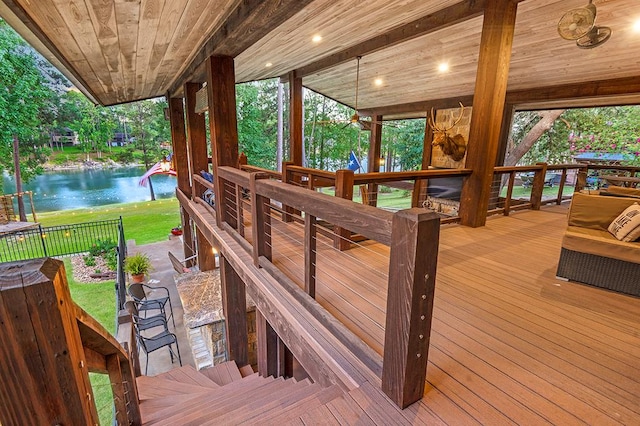 671 Lakeshore Dr, Brookeland, TX 75931 - wooden deck with a water view and a yard