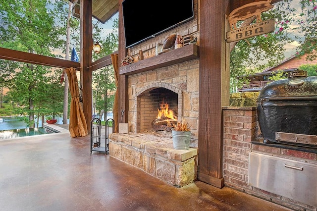 671 Lakeshore Dr, Brookeland, TX 75931 - view of patio / terrace with an outdoor stone fireplace and grilling area