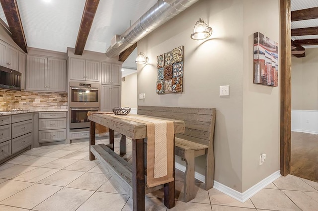 671 Lakeshore Dr, Brookeland, TX 75931 - dining room featuring beam ceiling and light tile patterned flooring