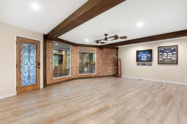 671 Lakeshore Dr, Brookeland, TX 75931 - entryway with beam ceiling, ceiling fan, wood finished floors, brick wall, and recessed lighting