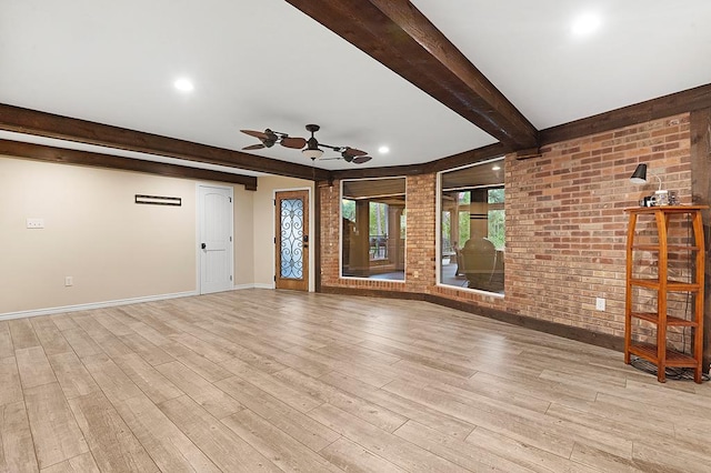 671 Lakeshore Dr, Brookeland, TX 75931 - unfurnished living room with beamed ceiling, ceiling fan, brick wall, light wood-style flooring, and recessed lighting