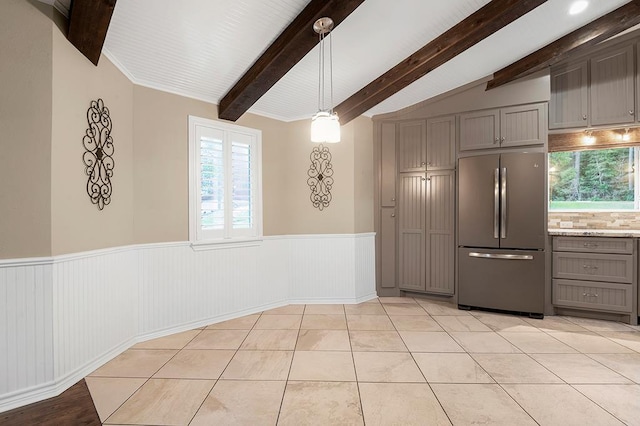 671 Lakeshore Dr, Brookeland, TX 75931 - kitchen featuring freestanding refrigerator, gray cabinetry, wainscoting, healthy amount of natural light, and hanging light fixtures