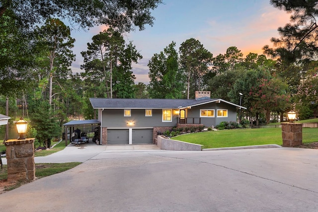 671 Lakeshore Dr, Brookeland, TX 75931 - ranch-style house with driveway, a yard, a chimney, brick siding, and an attached garage