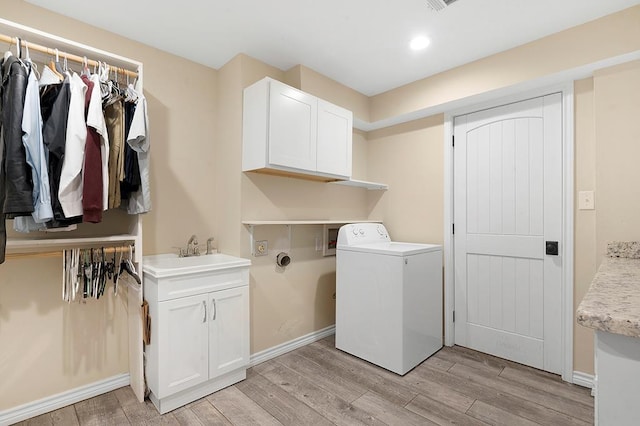 671 Lakeshore Dr, Brookeland, TX 75931 - laundry area featuring washer / dryer, cabinet space, light wood finished floors, and recessed lighting