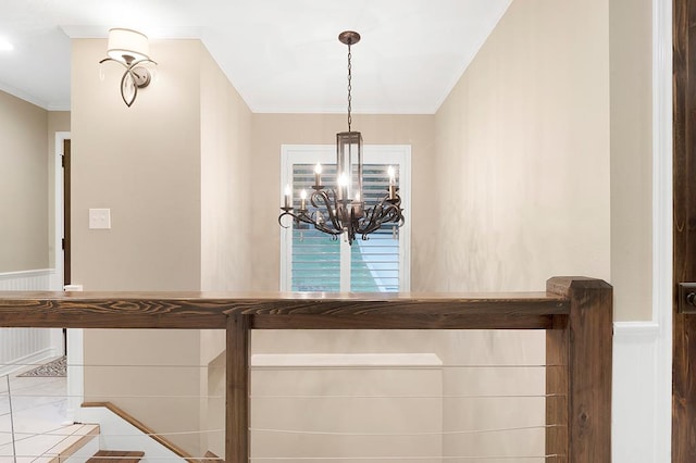 671 Lakeshore Dr, Brookeland, TX 75931 - detailed view of crown molding, a wainscoted wall, and a chandelier