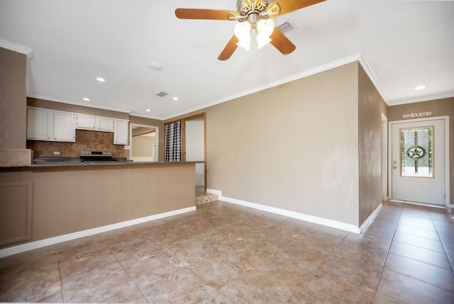 kitchen with backsplash, ornamental molding, white cabinetry, stainless steel range oven, and kitchen peninsula