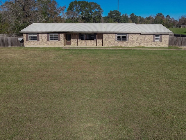 ranch-style home featuring a front yard