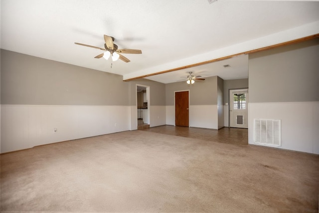 carpeted spare room with ceiling fan