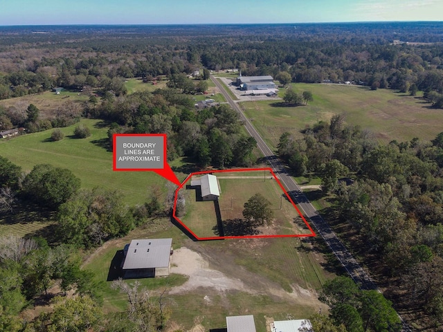 birds eye view of property featuring a rural view