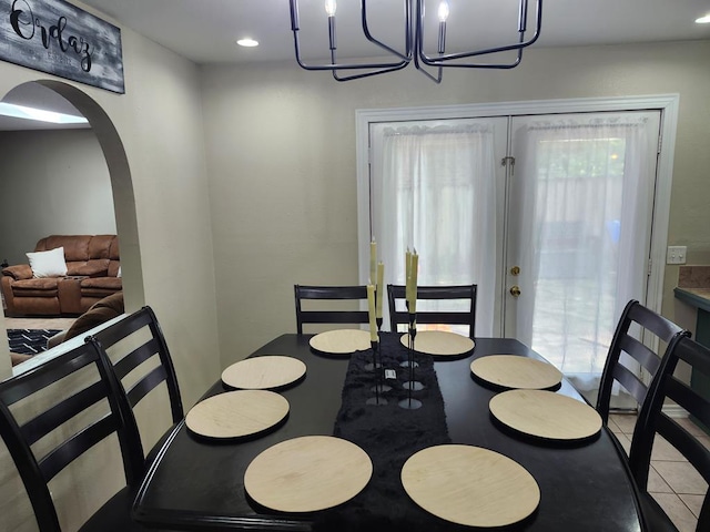 1805 Hanks St, Lufkin, TX 75904 - dining space with a chandelier, tile patterned floors, recessed lighting, and arched walkways