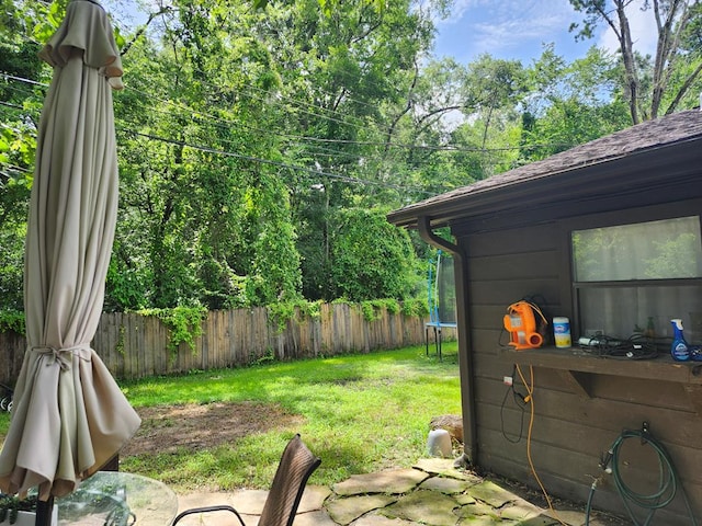 1805 Hanks St, Lufkin, TX 75904 - fenced backyard featuring a trampoline