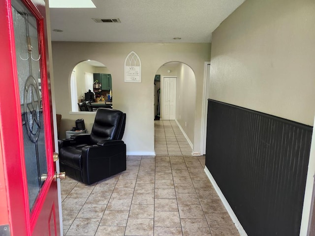 1805 Hanks St, Lufkin, TX 75904 - hallway with light tile patterned flooring and arched walkways
