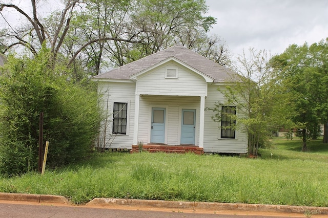 306 S Harrison, San Augustine, TX 75972 - view of front of house with a shingled roof