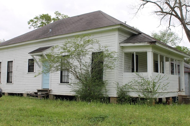 306 S Harrison, San Augustine, TX 75972 - view of side of home with entry steps and roof with shingles