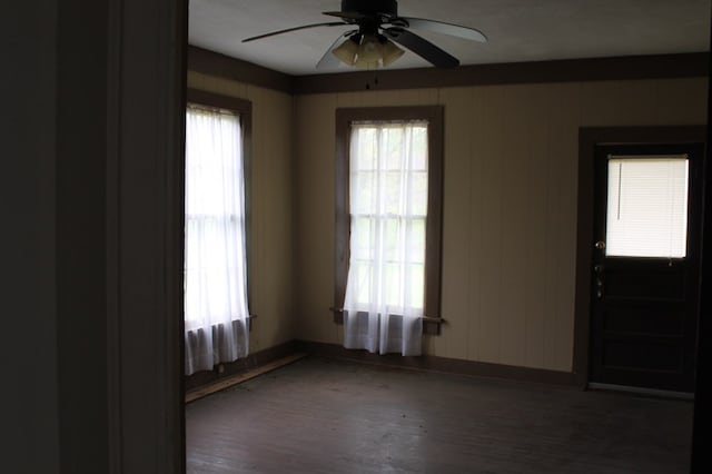 306 S Harrison, San Augustine, TX 75972 - spare room featuring ceiling fan, wood finished floors, and baseboards