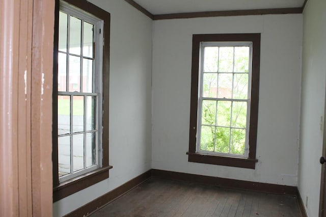 306 S Harrison, San Augustine, TX 75972 - unfurnished room with healthy amount of natural light, wood-type flooring, and baseboards