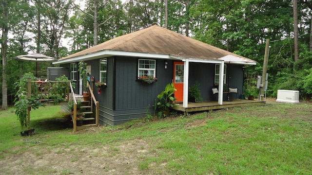 view of outdoor structure with a lawn