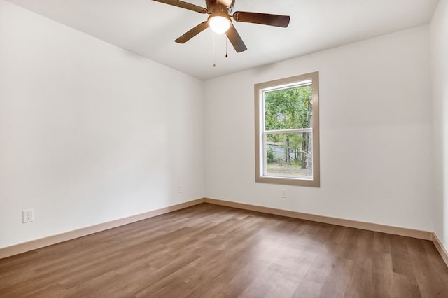 spare room featuring ceiling fan and hardwood / wood-style flooring