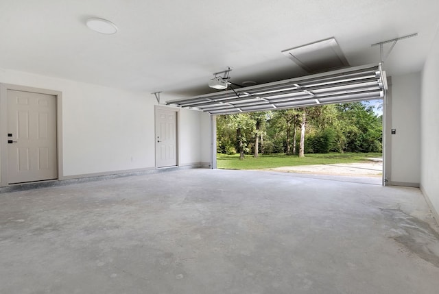 garage featuring a yard and a garage door opener