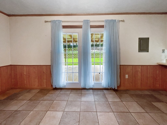 33963 US Highway 96, Buna, TX 77612 - doorway to outside featuring crown molding, a wainscoted wall, and wooden walls