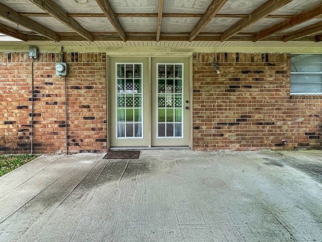 33963 US Highway 96, Buna, TX 77612 - view of exterior entry with a patio and brick siding