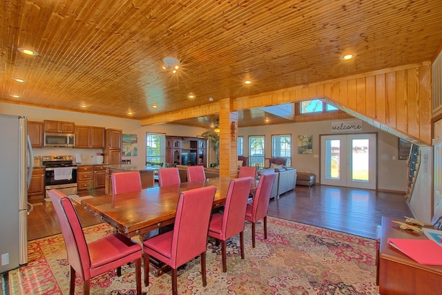 dining area featuring decorative columns, french doors, wooden ceiling, and light wood-type flooring