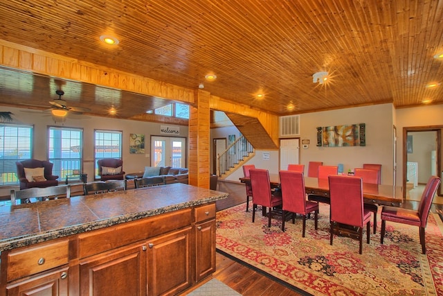 dining space with light hardwood / wood-style flooring, ceiling fan, crown molding, and wood ceiling