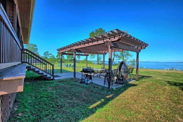 view of yard featuring a pergola, a water view, and a patio area