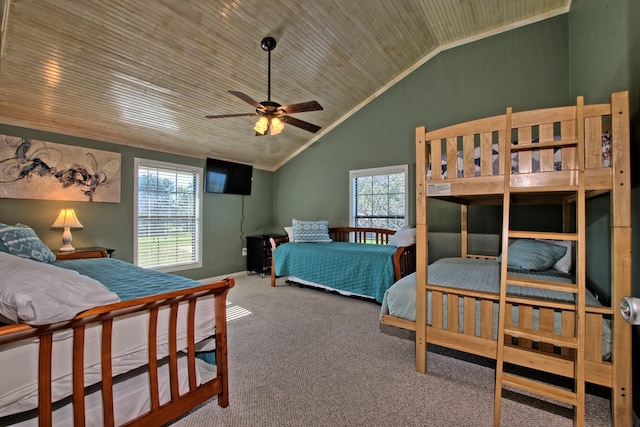 carpeted bedroom featuring ceiling fan, crown molding, wooden ceiling, and vaulted ceiling