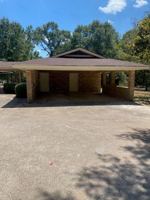 view of side of home featuring a carport