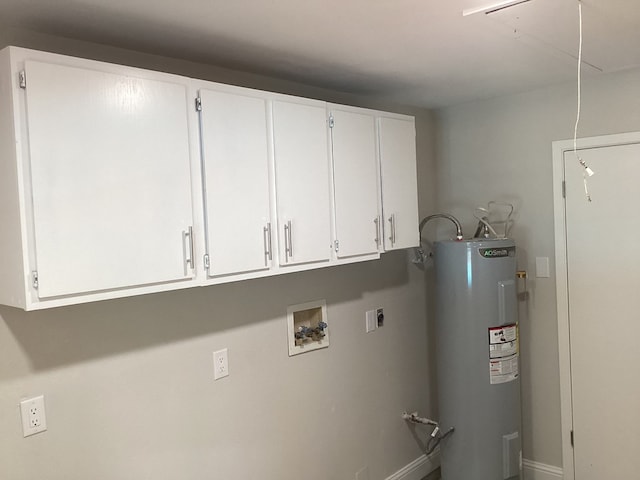 laundry area with cabinets, hookup for a washing machine, electric water heater, and electric dryer hookup