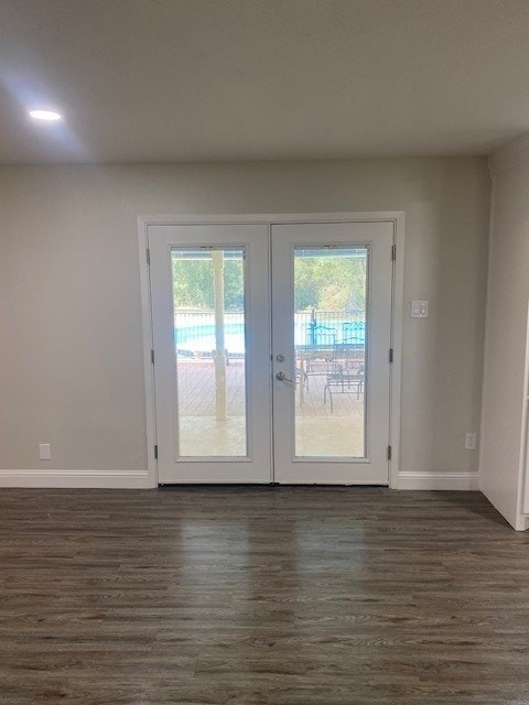 doorway featuring dark wood-type flooring and french doors