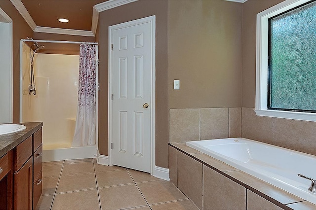 bathroom featuring tile patterned flooring, vanity, ornamental molding, and plus walk in shower