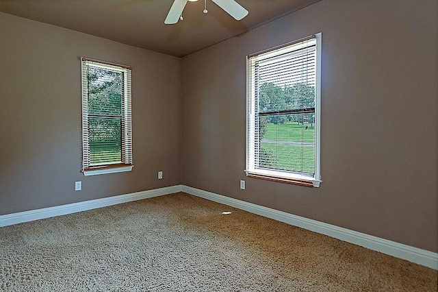 spare room with carpet flooring and ceiling fan