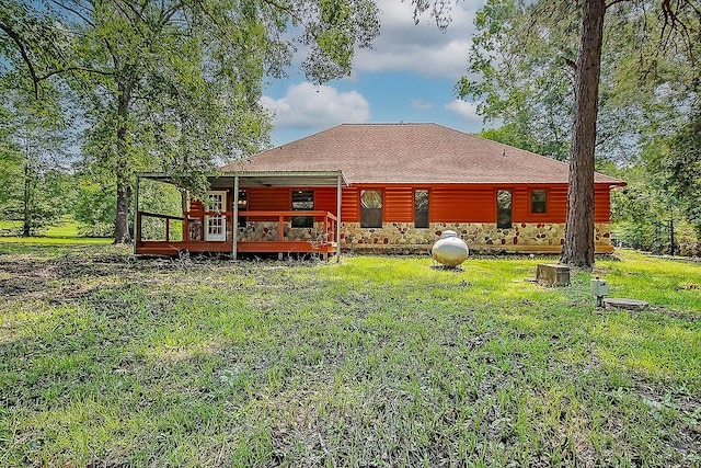 back of house with a yard and a deck