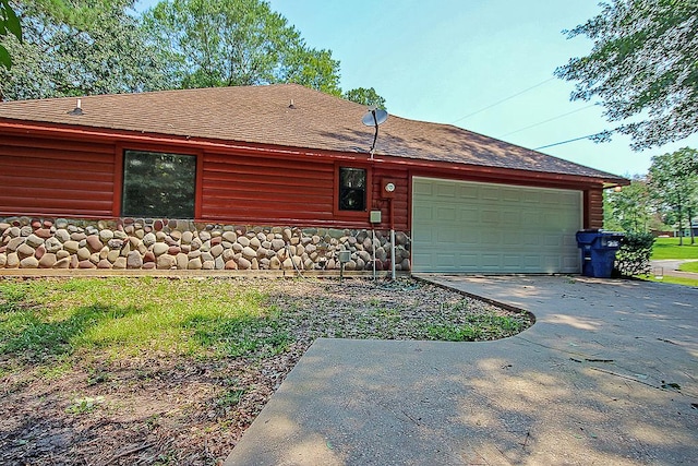 view of side of property with a garage