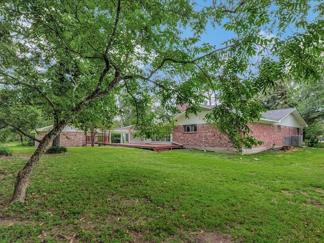 200 Platt Rd, Lufkin, TX 75904 - view of grassy yard featuring a deck and cooling unit
