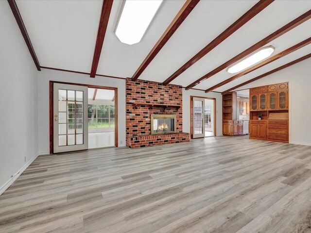 200 Platt Rd, Lufkin, TX 75904 - unfurnished living room with light wood-style floors, baseboards, and a fireplace