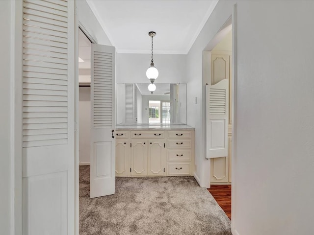 200 Platt Rd, Lufkin, TX 75904 - kitchen featuring ornamental molding, light countertops, carpet, hanging light fixtures, and baseboards