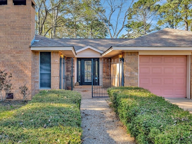 view of front facade featuring brick siding, a garage, and roof with shingles