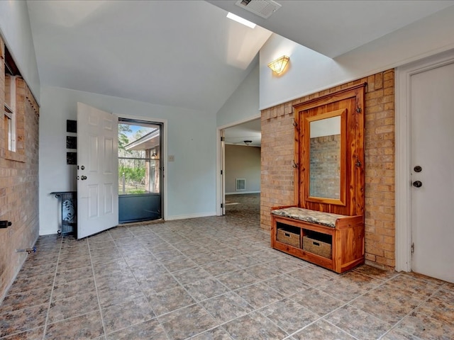 entrance foyer with visible vents, lofted ceiling, and baseboards