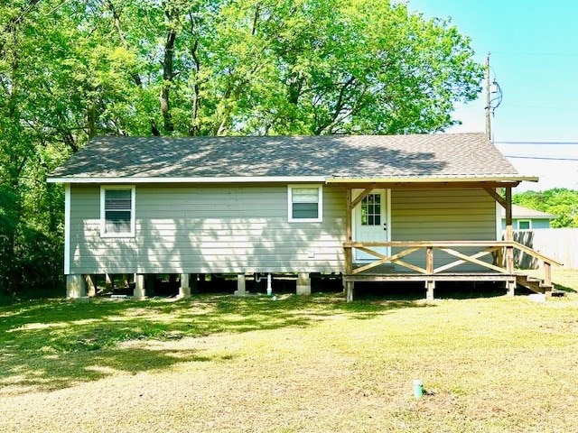 back of house with a yard