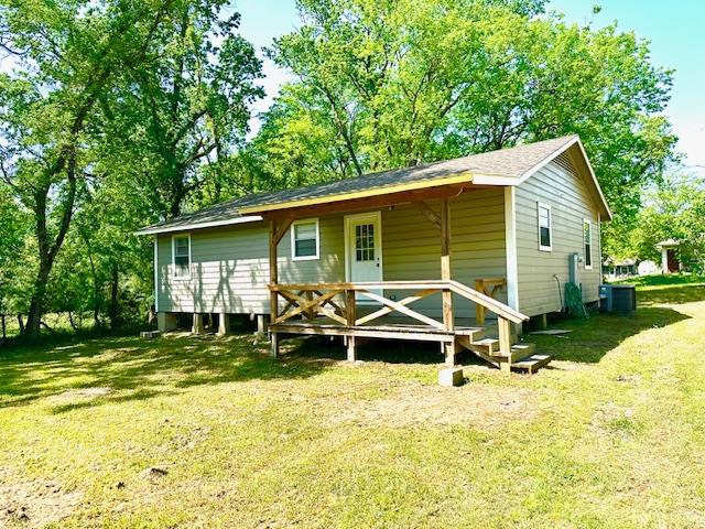 308 Pine, Diboll, TX 75941 - back of house with a lawn and cooling unit